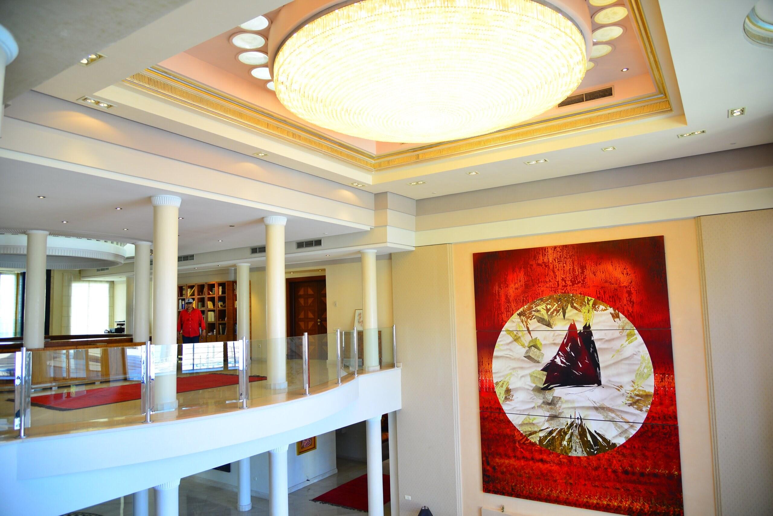 The crystal-tube chandelier and a d’Onofrio painting in the grand salon